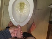 She aims his dick at the hotel toilet