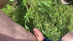 guy pissing outdoors in shorts