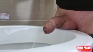 Uncircumcised cock peeing with a big stream