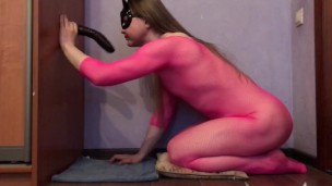 Sissy in pink deepthroats a dildo and plays with her clitty