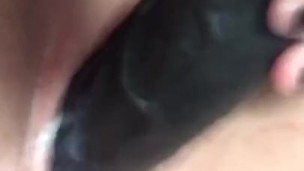 Creamy little pussy getting fucked by huge black dildo
