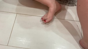Pedicure/nail polish change on my big feet :) bright cherry red nails