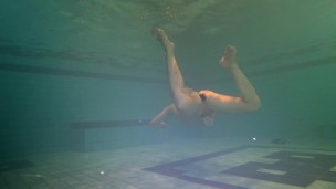 Tight ass finds dildo underwater and swims with it