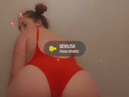 Redhead twerks in sexy red one piece bathing suit 