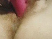 Close Up of Girl Using Vibrating Toys on her Hairy Pussy