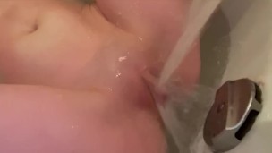 Young skinny female masturbation pussy and clit with water and pissing (1)