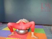 Regina Noir. A woman in yoga leotards practices yoga in the gym. Transparent red leotard yoga. 2 2/16