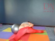 Regina Noir. A woman in yoga leotards practices yoga in the gym. Transparent red leotard yoga. 2 4/16