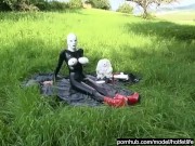 Rubber Girl Full in Black Latex Catsuit and Mask Plays with herself Outdoor in a Meadow - Part 3