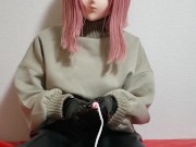kigurumi plays with her PVC gloves.