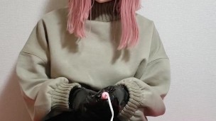 kigurumi plays with her PVC gloves.