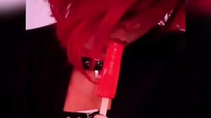 Goth babe licking & sucking red blowpop