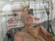 Hot milf with latex condom hood on her head and rubber sheet has fun with breathing games 11/16