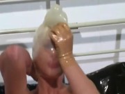 Hot milf with latex condom hood on her head and rubber sheet has fun with breathing games 8/16