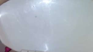 This slut loves to show me her big vagina while going to the bathroom