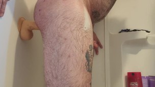 Riding a huge dildo in the shower 