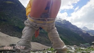 Traveler peeing in mountains - Angel Fowler 