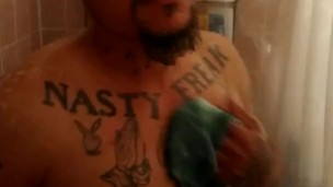 Thug jacks off until he cums on himself