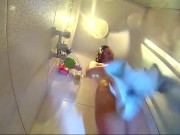 Voyeur camera in the shower. Young nude girl rubs her body with massage oil 3/16