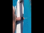 Naked and peeing in the pool.