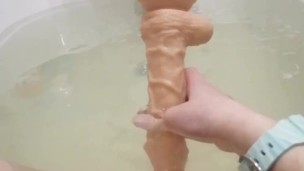 Kitty plays in the bathroom with a huge toy Loly_Kitty