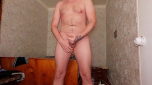 The guy jerks off a dick, moans loudly and swears