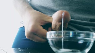 Thick cumshot into bowl