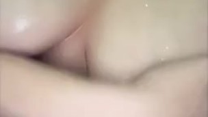 Plays with tits in shower