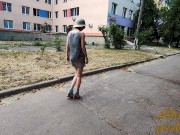 Slut walks in a mini dress with a fully transparent skirt