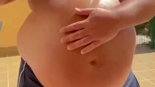 Oiling my massive belly…