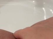 Hot milf alone in her bathroom rubbing her shaved pussy 