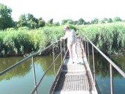 Messalina Dressed in Sun. Outside Outdoor. Nude Milf walks by bridge River. Naturist Nudist Woman 14/16