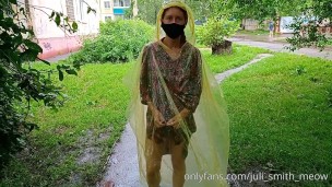Risky flash of boobs and butt in the rain in a transparent raincoat