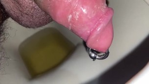 Nasty big pierced cock peeing