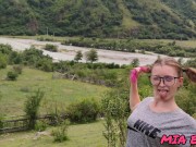 beauty with pink tips walks in nature in the mountains attracting attention to herself