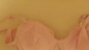 pissing on cup of pink bra!