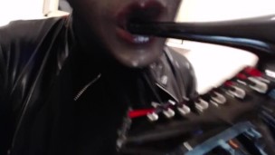 Sucking and spitting heels and dildo in silicone mask and black nylon encasement