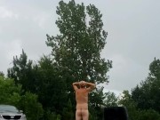 Hairy ginger playing in the rain with floppy cock