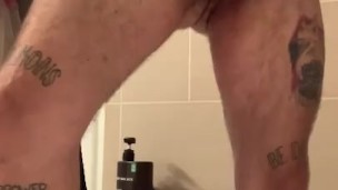 BIG DICK TATTOOED GUY JERKS OFF AND RUBS BALLS STANDING UP, SHOOTS HUGE LOAD