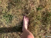 A Girl Walks In Nature In A Skirt And Massages Her Feet 6/16