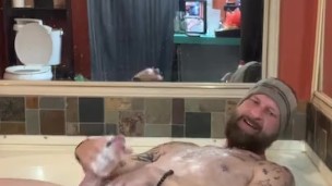 Sexy guy strokes his cock and body