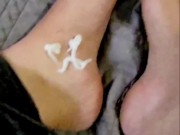 Squirting lotion on my feet and seductively massaging
