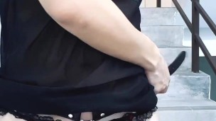 Crossdresser masturbating publicly on stairs