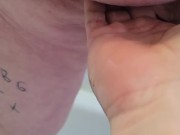 Submissive pisses on owners hand.    15/16