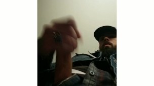 Bearded biker jacks off moans and cums