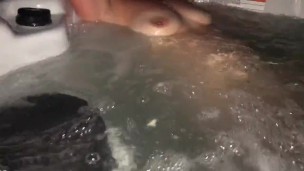Sneak peak of my wife’s tits in our backyard hot tub tonight
