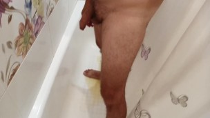 In the bathroom I piss and jerk off my dick.