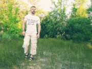 The guy jerks off and cums in a forest clearing