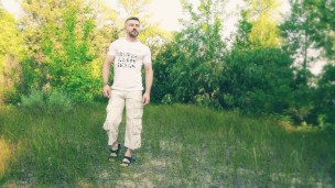 The guy jerks off and cums in a forest clearing