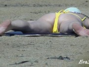 Mom undresses on the beach thinking that no one sees her 2/16